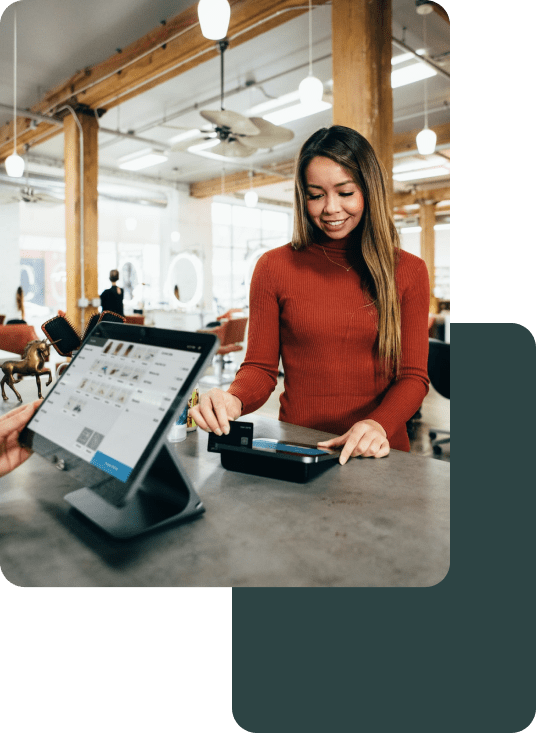 Woman who is paying for her goods at the Point Of Sale Terminal