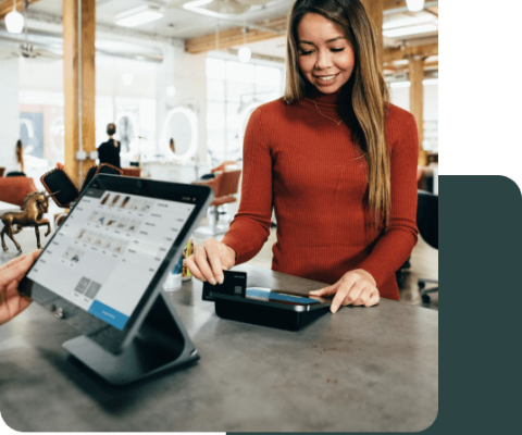 Woman who is paying for her goods at the Point Of Sale Terminal
